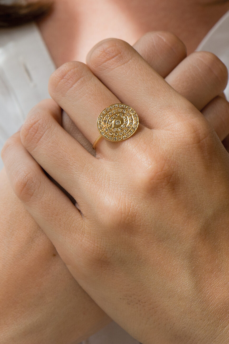 Yellow gold wide ring circular pavé diamond disc eye motif Celine Daoust