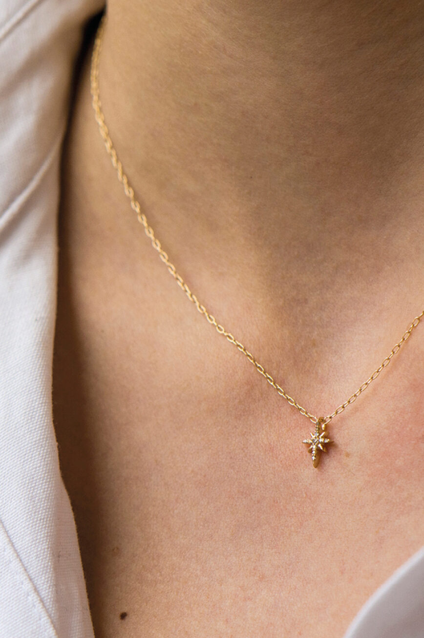 rose gold fine chain necklace with a small eight-pointed north star pendant pavé-set with round brilliant diamonds