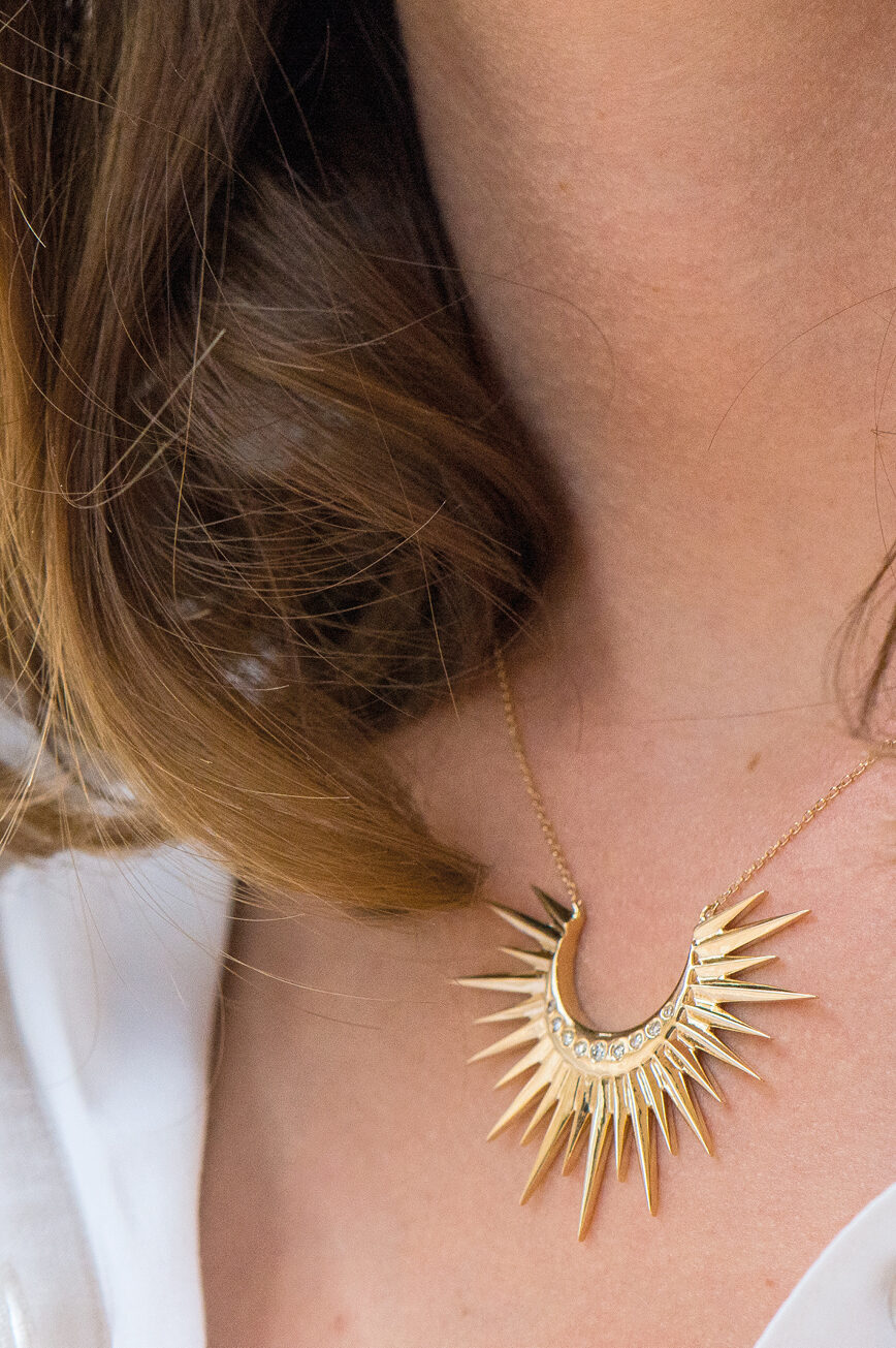 Yellow gold necklace large crescent sun ray diamond spike pendant worn on neck Celine Daoust