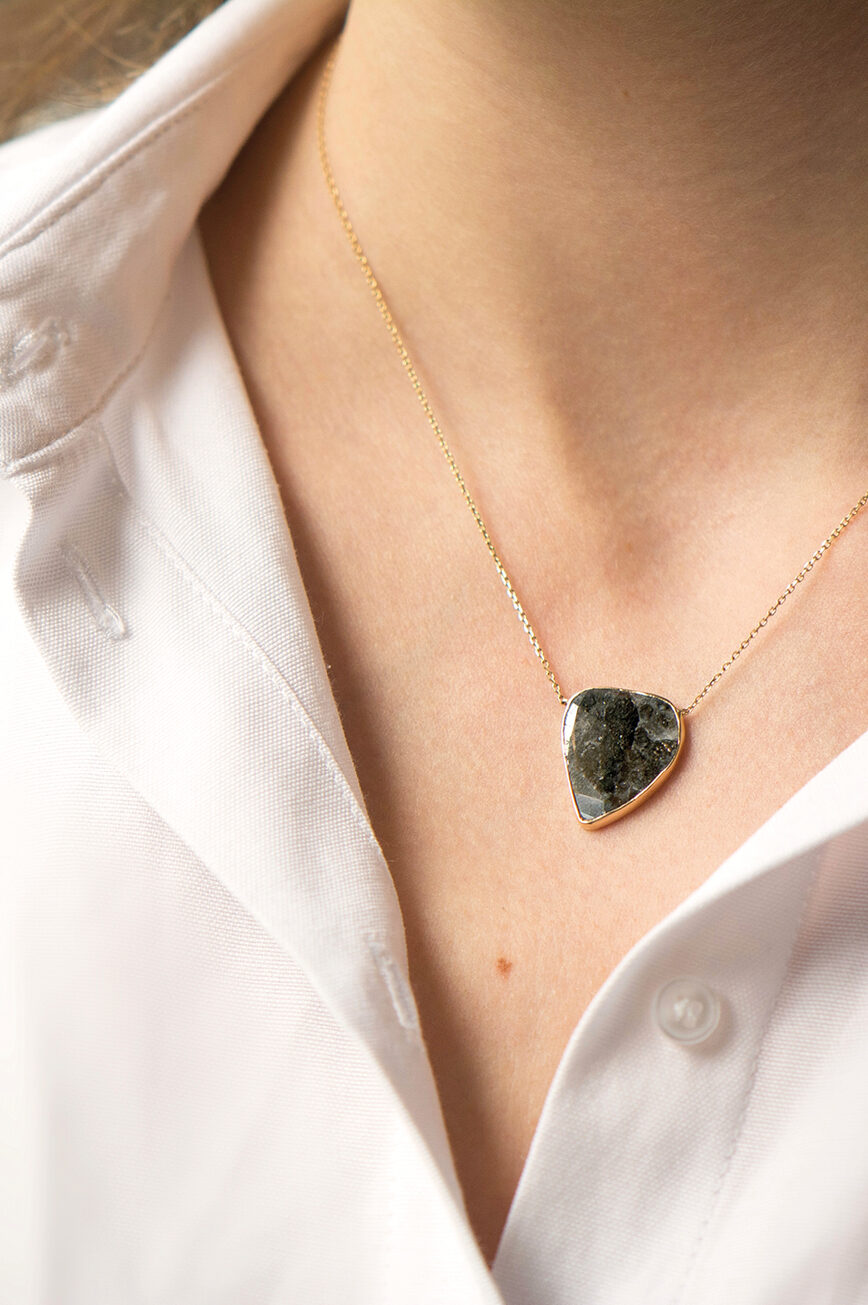 Yellow gold necklace freeform grey diamond slice bezel pendant worn on neck Celine Daoust