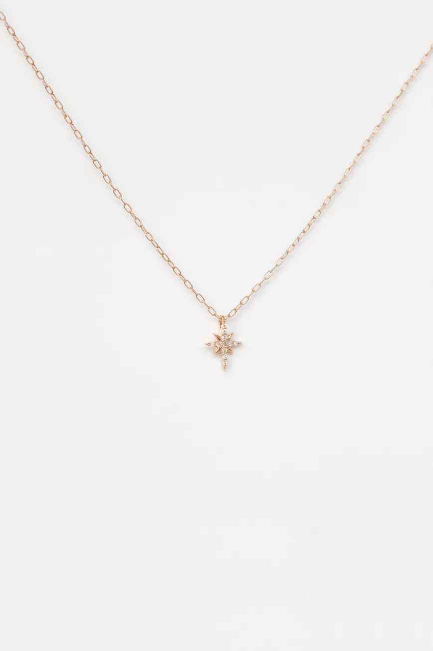 rose gold fine chain necklace with a small eight-pointed north star pendant pavé-set with round brilliant diamonds