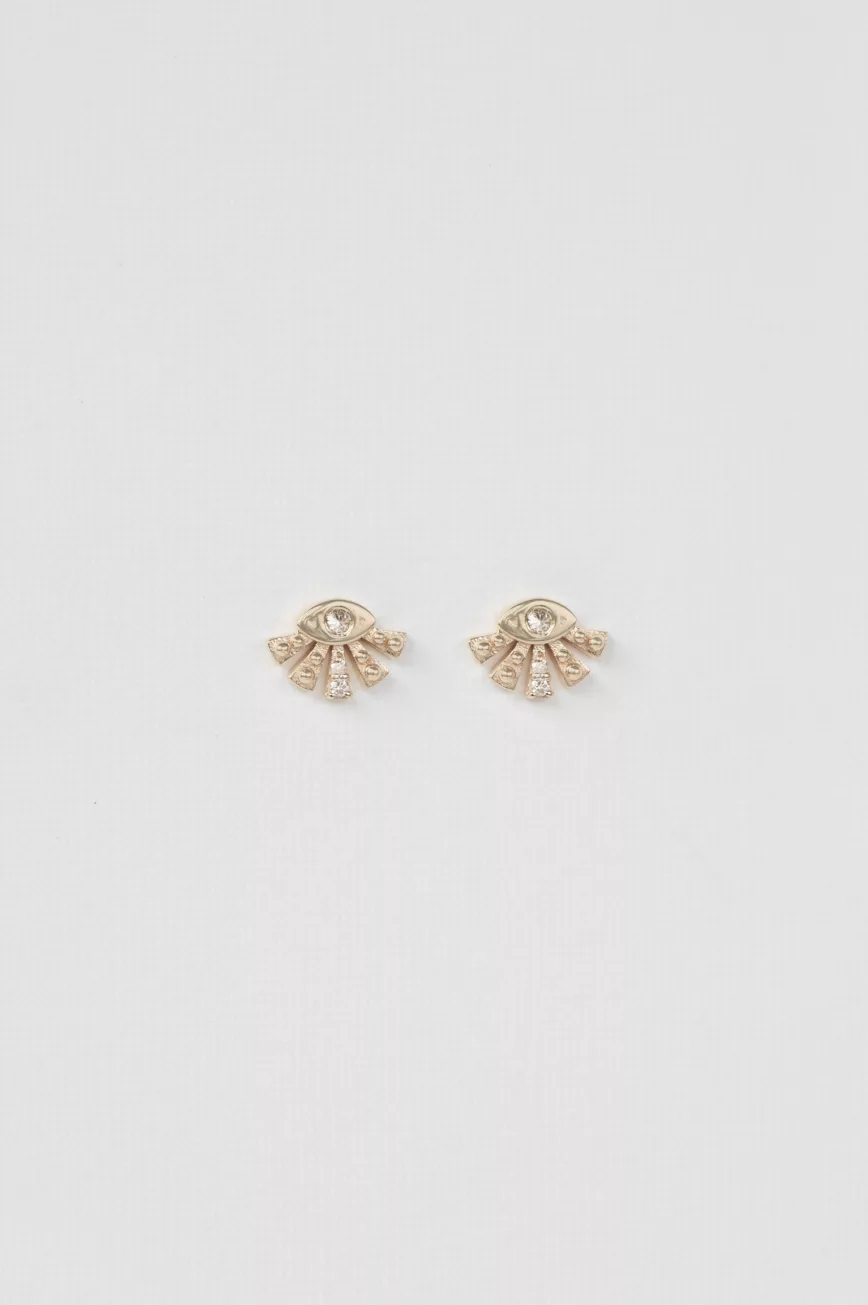 yellow gold stud earrings shaped as a small sunburst fan with a central diamond eye and radiating gold spikes, inspired by Aztec sun motifs