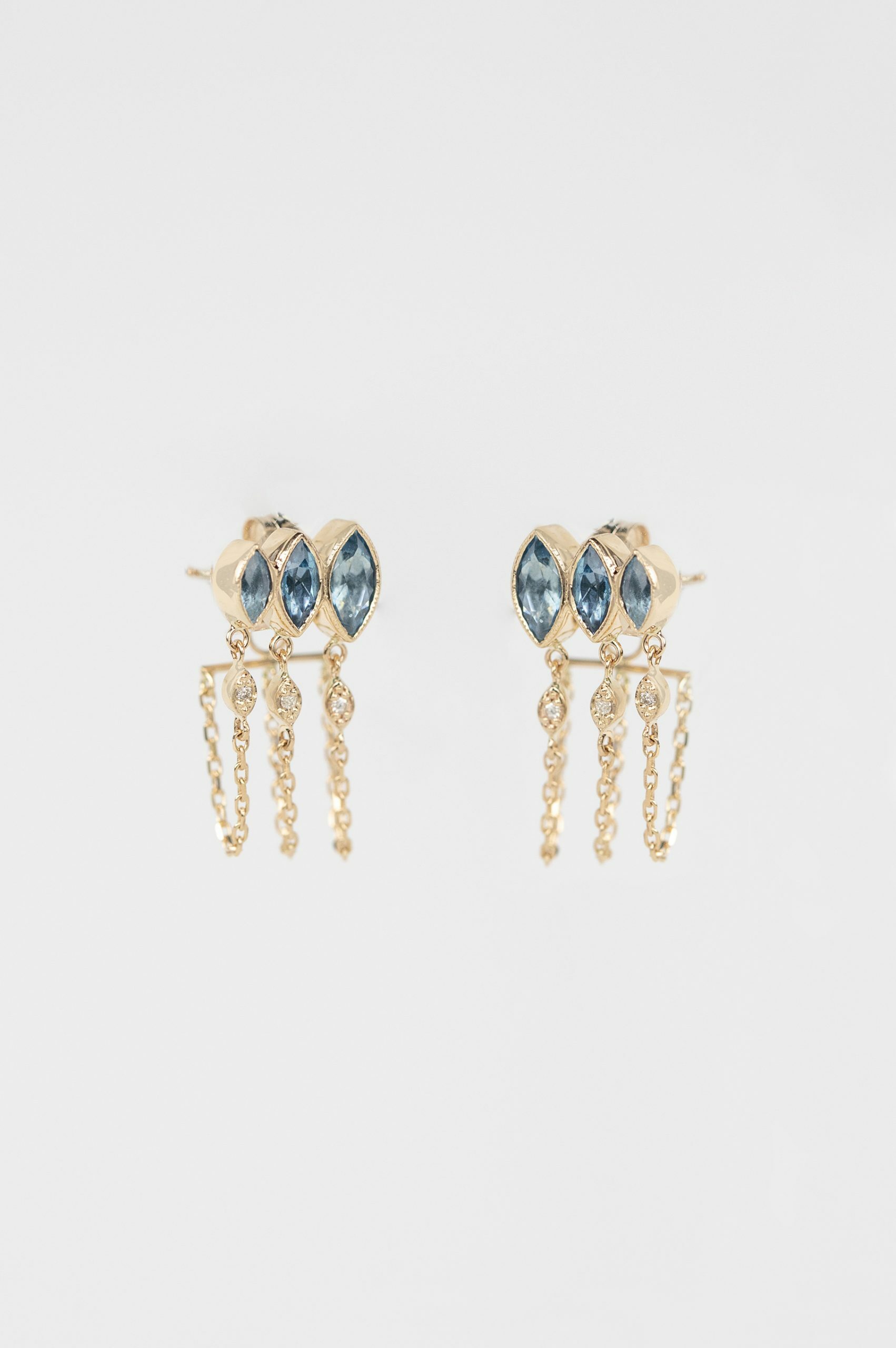 yellow gold drop earrings each with three marquise-cut aquamarines, suspending three fine gold chains with small diamond drops