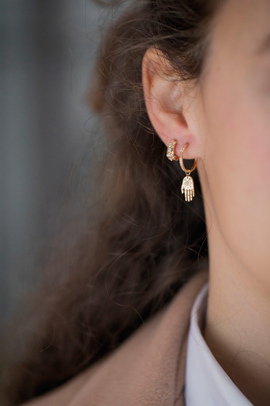Yellow gold single hoop earring small sculpted hand charm diamond accent drop Celine Daoust