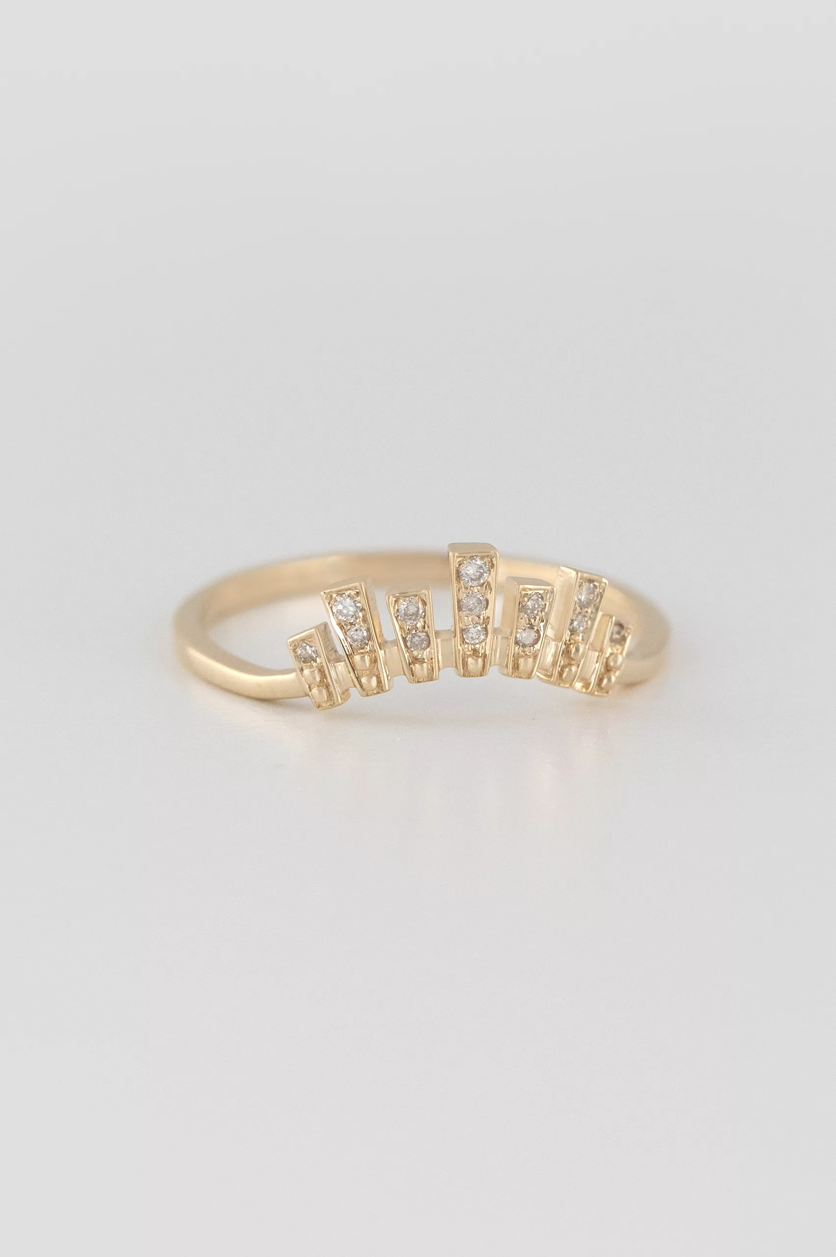 Yellow gold wide band ring multiple baguette diamond irregular crown motif Celine Daoust