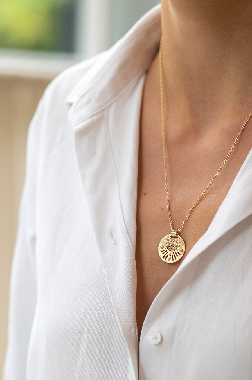 Yellow gold necklace round medal pendant diamond eye motif dangling chain Celine Daoust