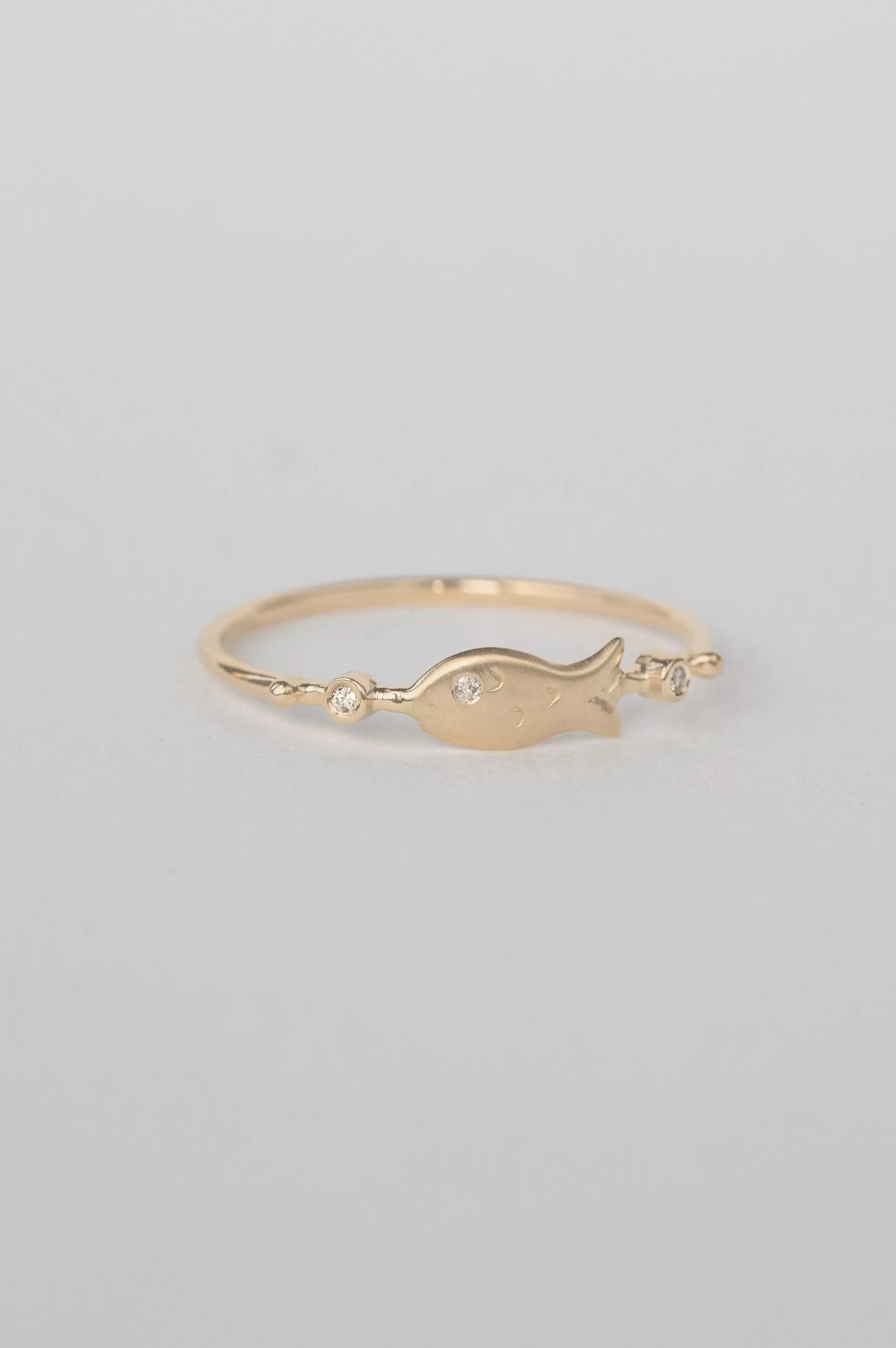 Yellow gold ring sculpted fish motif diamond accent slim band Celine Daoust