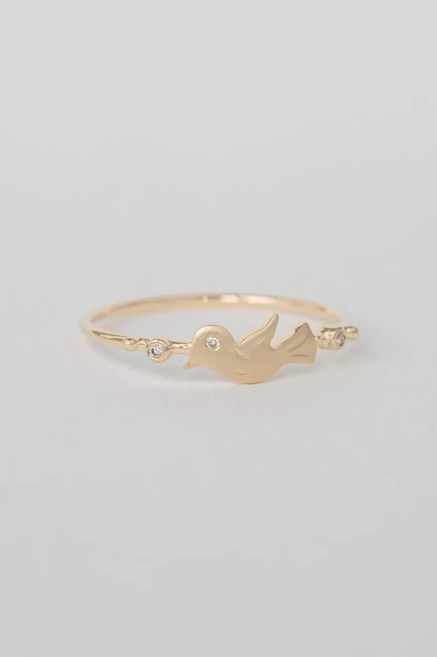 Yellow gold ring sculpted bird motif diamond accent slim band Celine Daoust