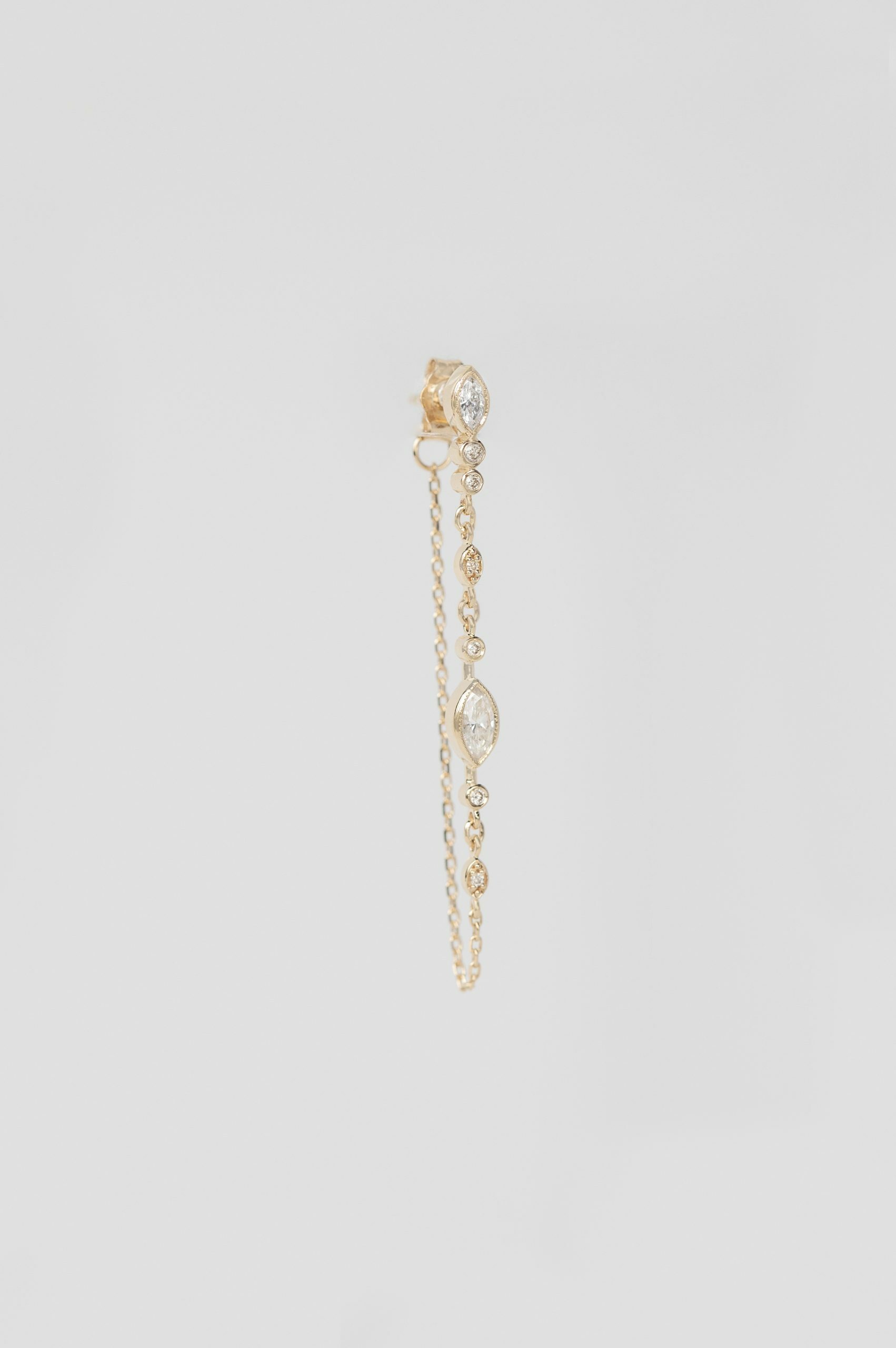 Yellow gold single long chain earring diamond eye motif chain drop Celine Daoust