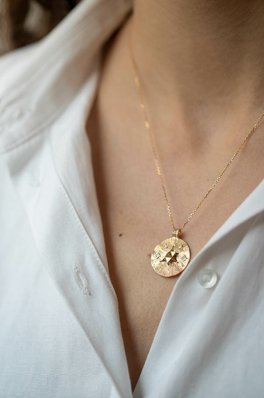 Yellow gold necklace round medal pendant diamond star merkabah motif chain Celine Daoust