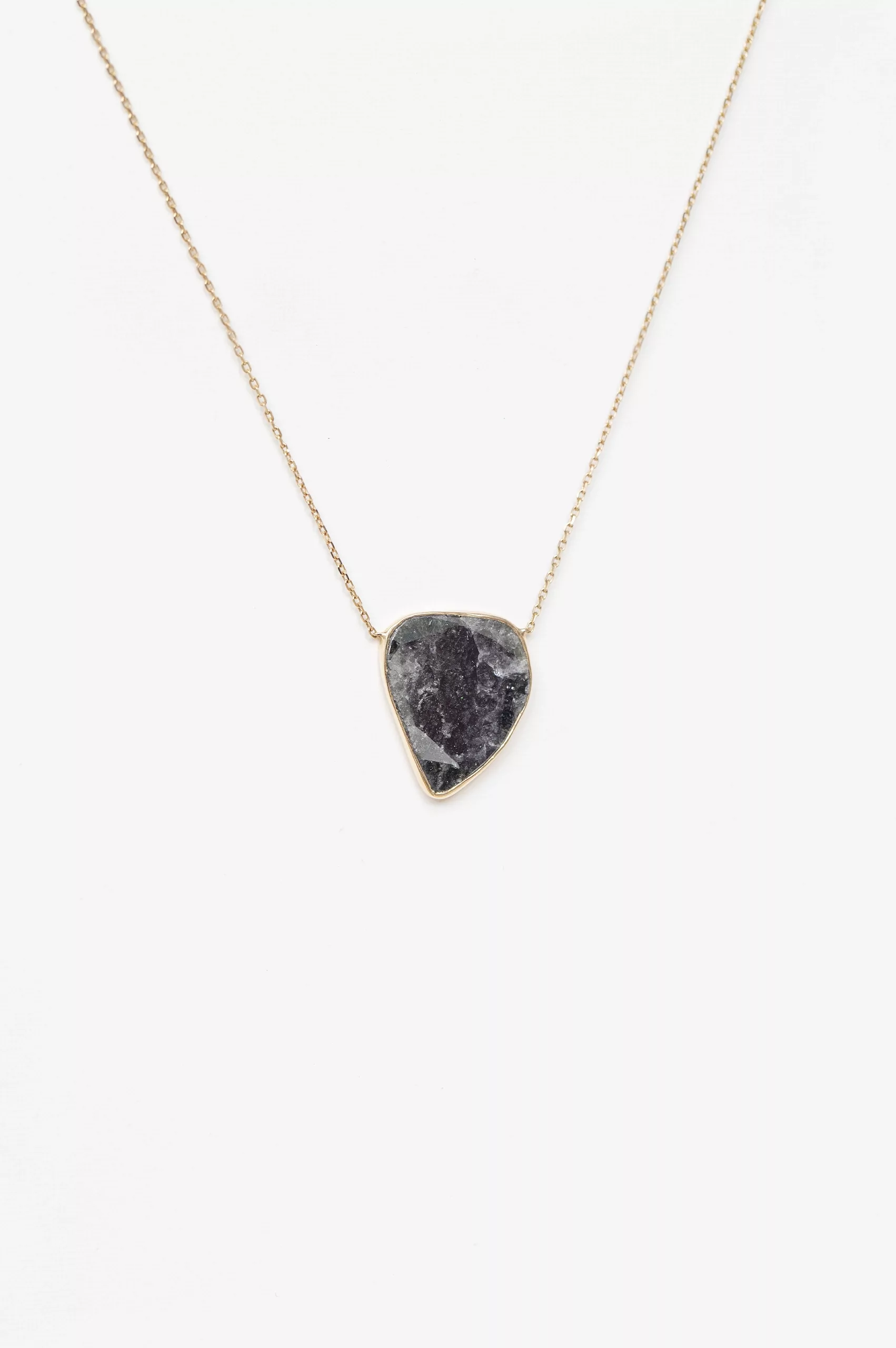 Yellow gold necklace freeform grey diamond slice bezel pendant worn on neck Celine Daoust