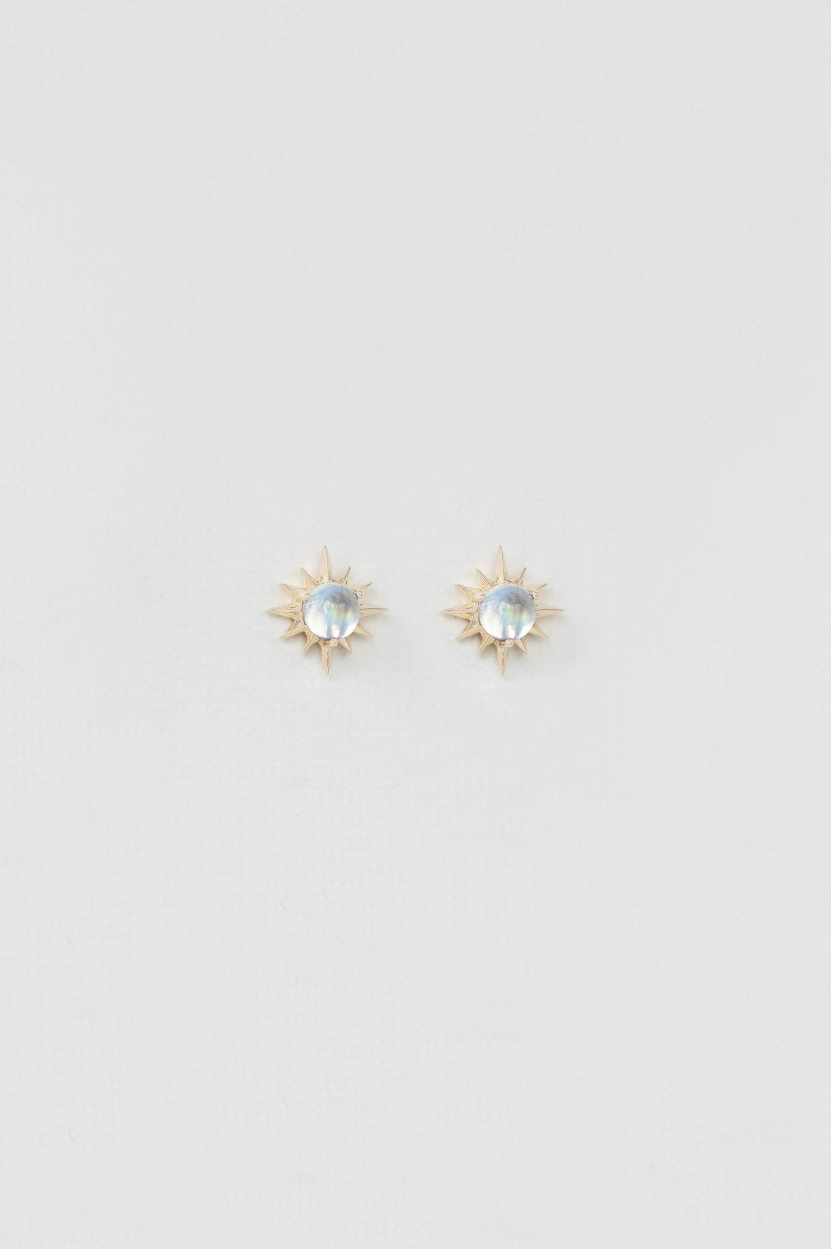 Yellow gold stud earrings round moonstone sun ray motif pair Celine Daoust