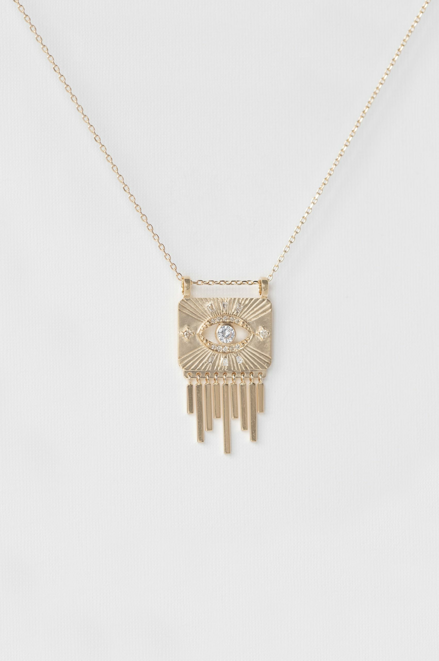 Yellow gold necklace solid gold plate pendant eye motif white sapphire diamond accents Celine Daoust