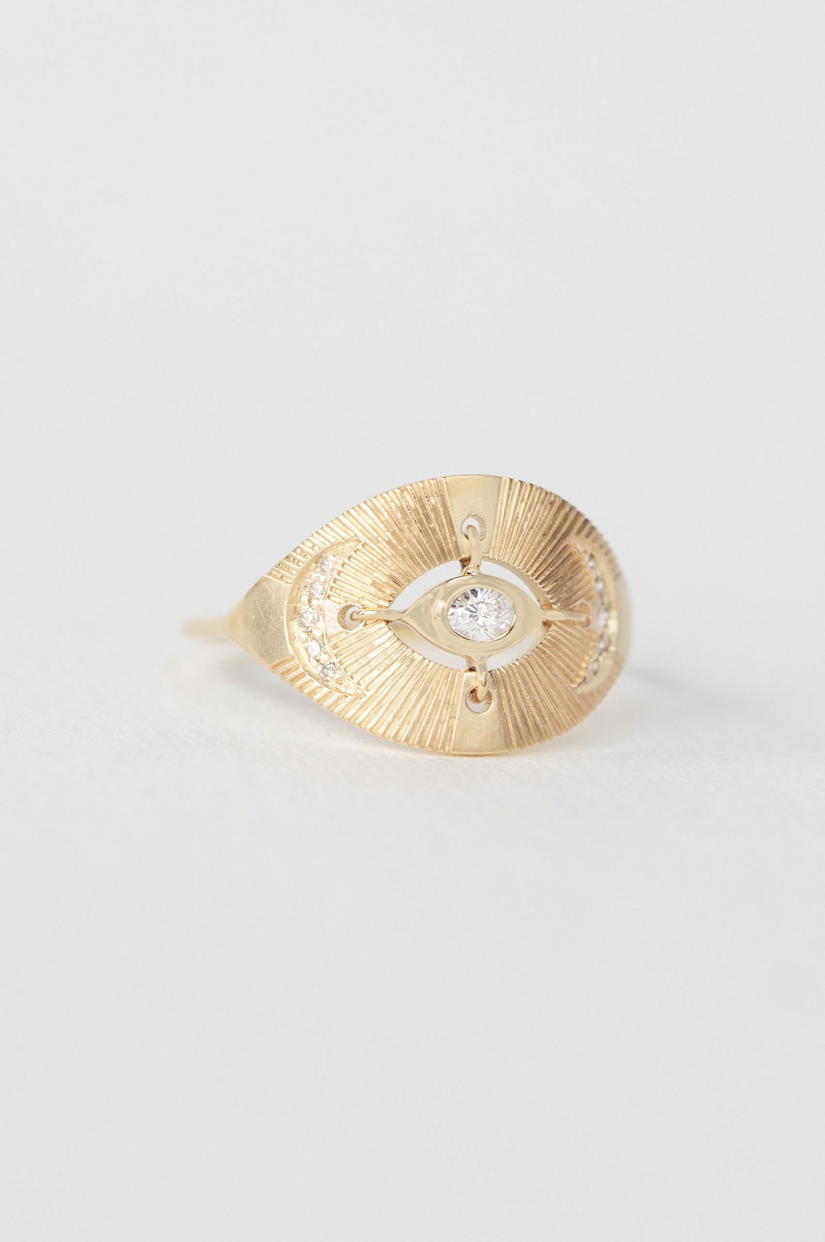Yellow gold signet ring marquise diamond open eye engraved moon motif Celine Daoust