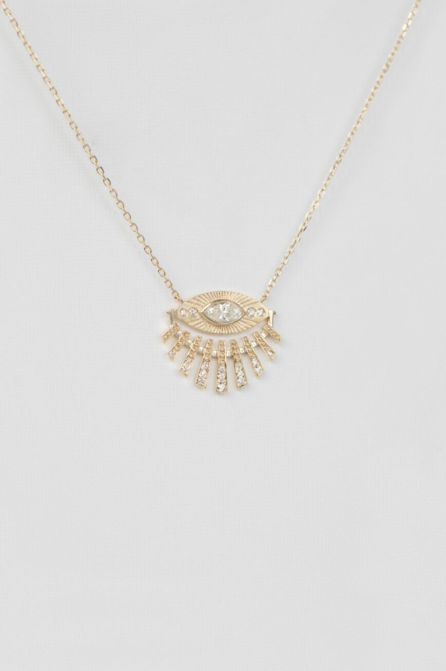 Yellow gold necklace open sun ray eye pendant diamond accents delicate chain Celine Daoust