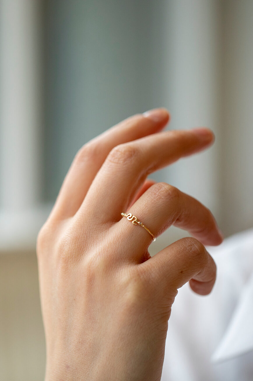Yellow gold ring sculpted snake motif diamond accent slim band Celine Daoust