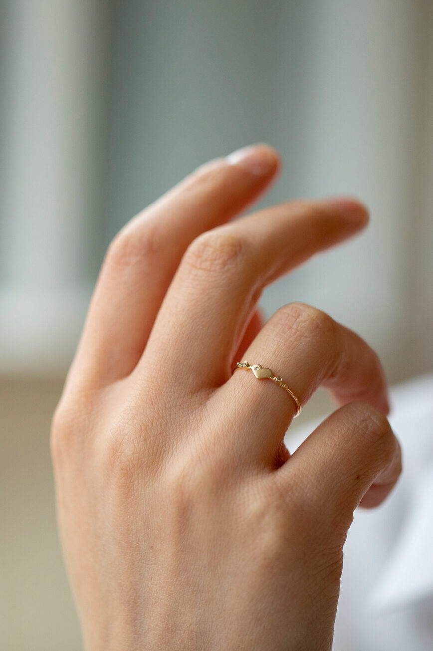Yellow gold ring sculpted heart motif diamond accent slim band Celine Daoust