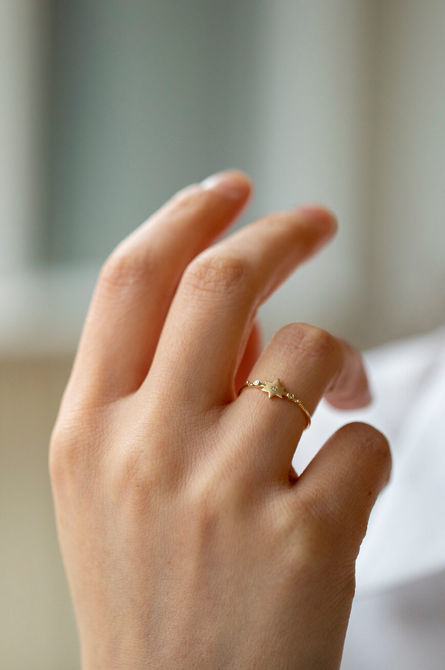 Yellow gold ring sculpted north star motif diamond accent slim band Celine Daoust