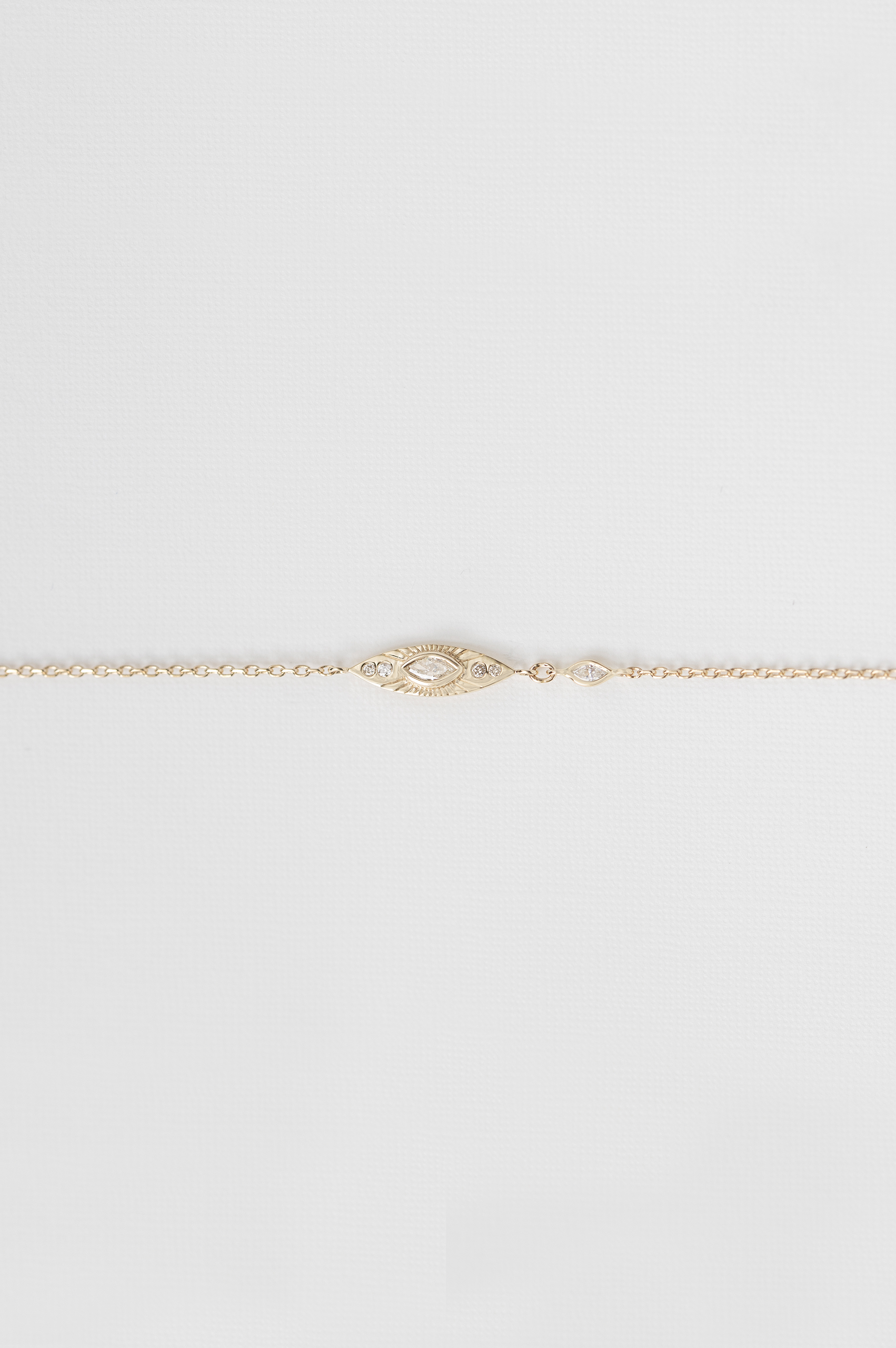 Yellow gold chain bracelet marquise sun eye diamond station Celine Daoust
