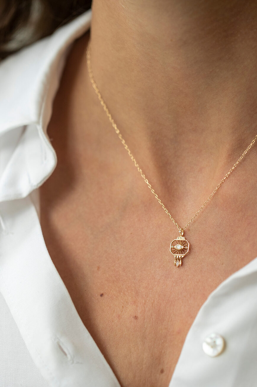 Gold necklace octagonal engraved pendant open eye diamond pearl drops Céline Daoust