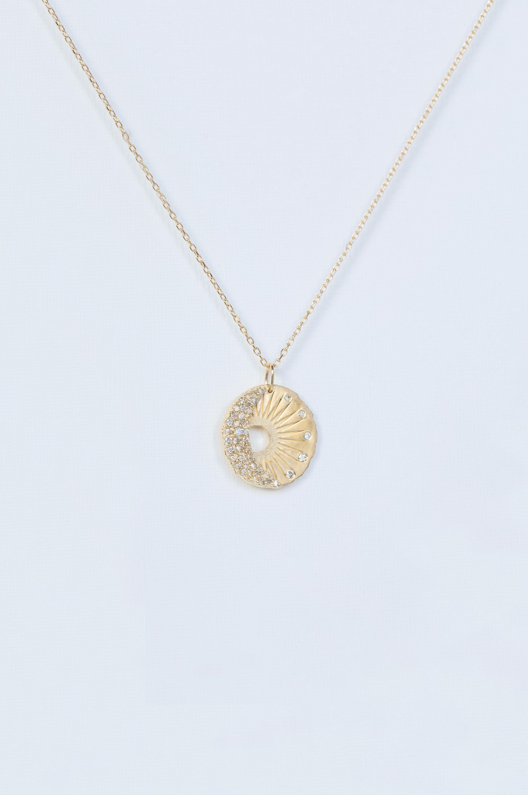 Yellow gold necklace round medal pendant sun moon motif diamond accents Celine Daoust