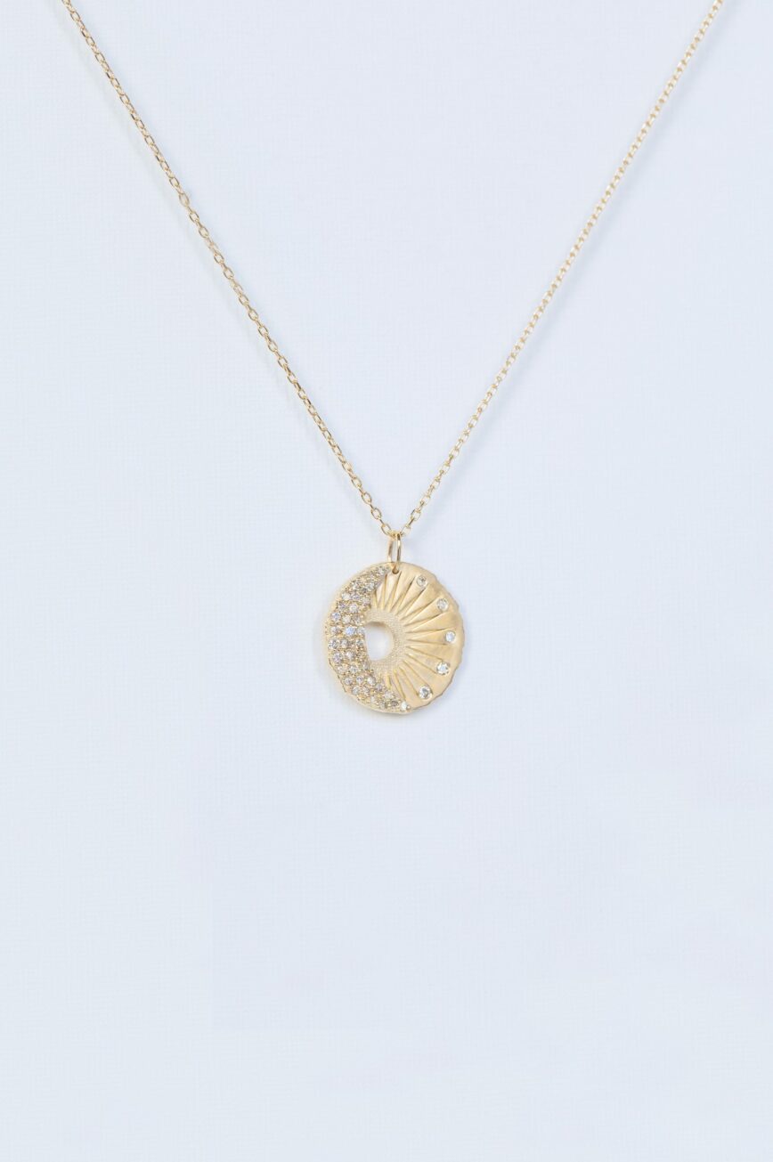 Yellow gold necklace round medal pendant sun moon motif diamond accents Celine Daoust