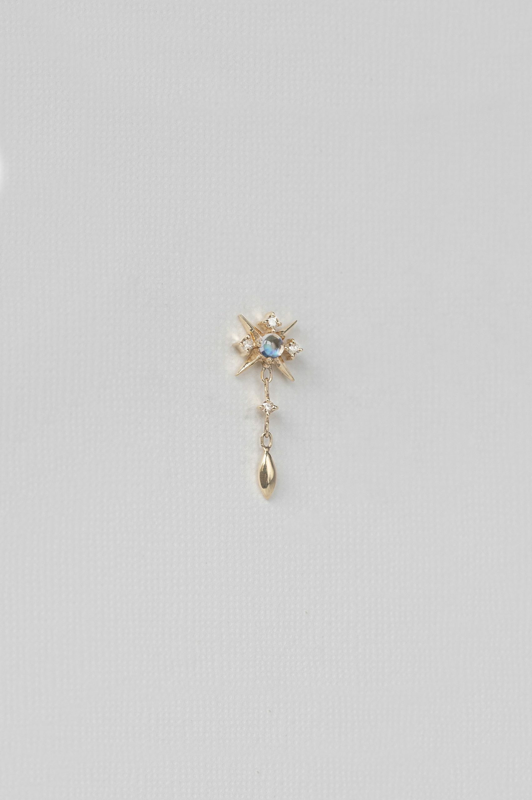 Yellow gold single drop earring starburst diamond motif moonstone gold drop Celine Daoust