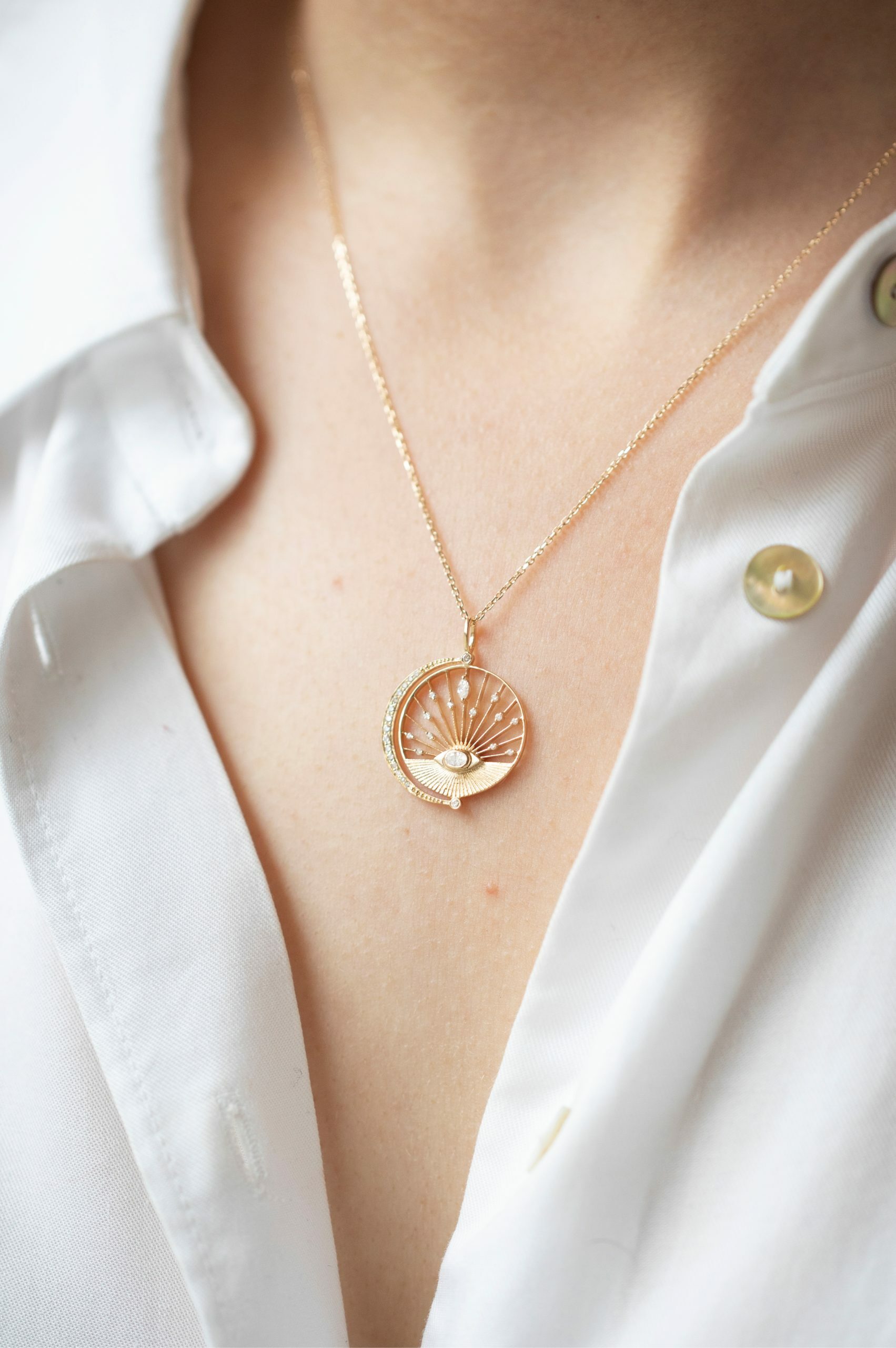 Yellow gold necklace round open disc pendant eye diamond moon crescent motif Celine Daoust