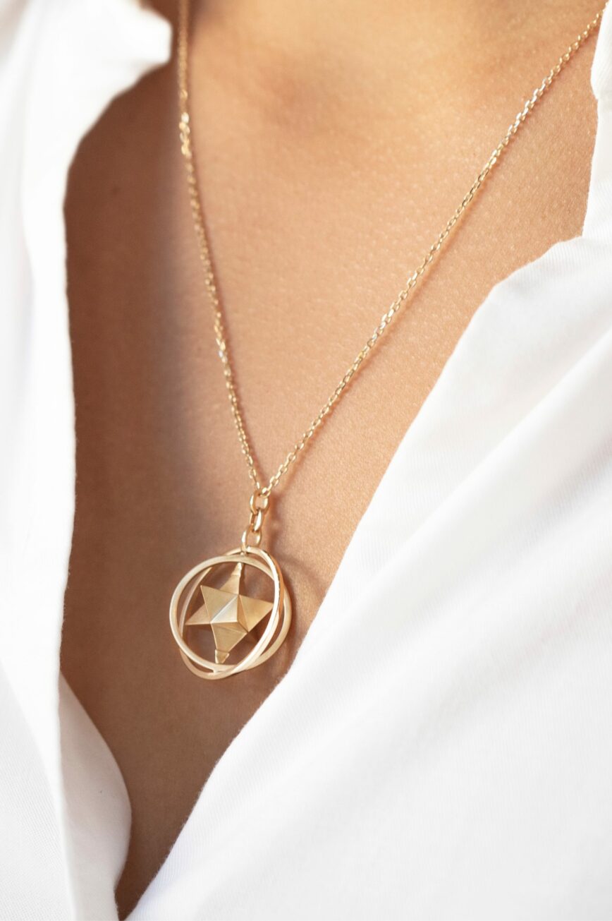 Yellow gold necklace moving merkabah star geometric pendant chain Celine Daoust