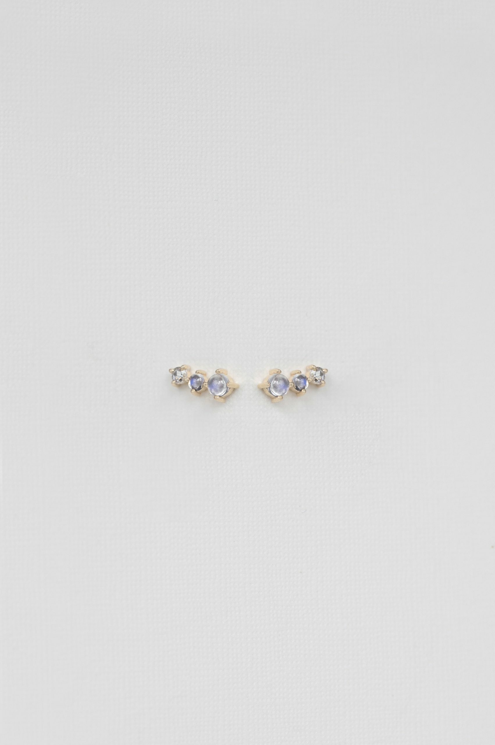 Gold stud earrings two oval moonstones one diamond trio Céline Daoust