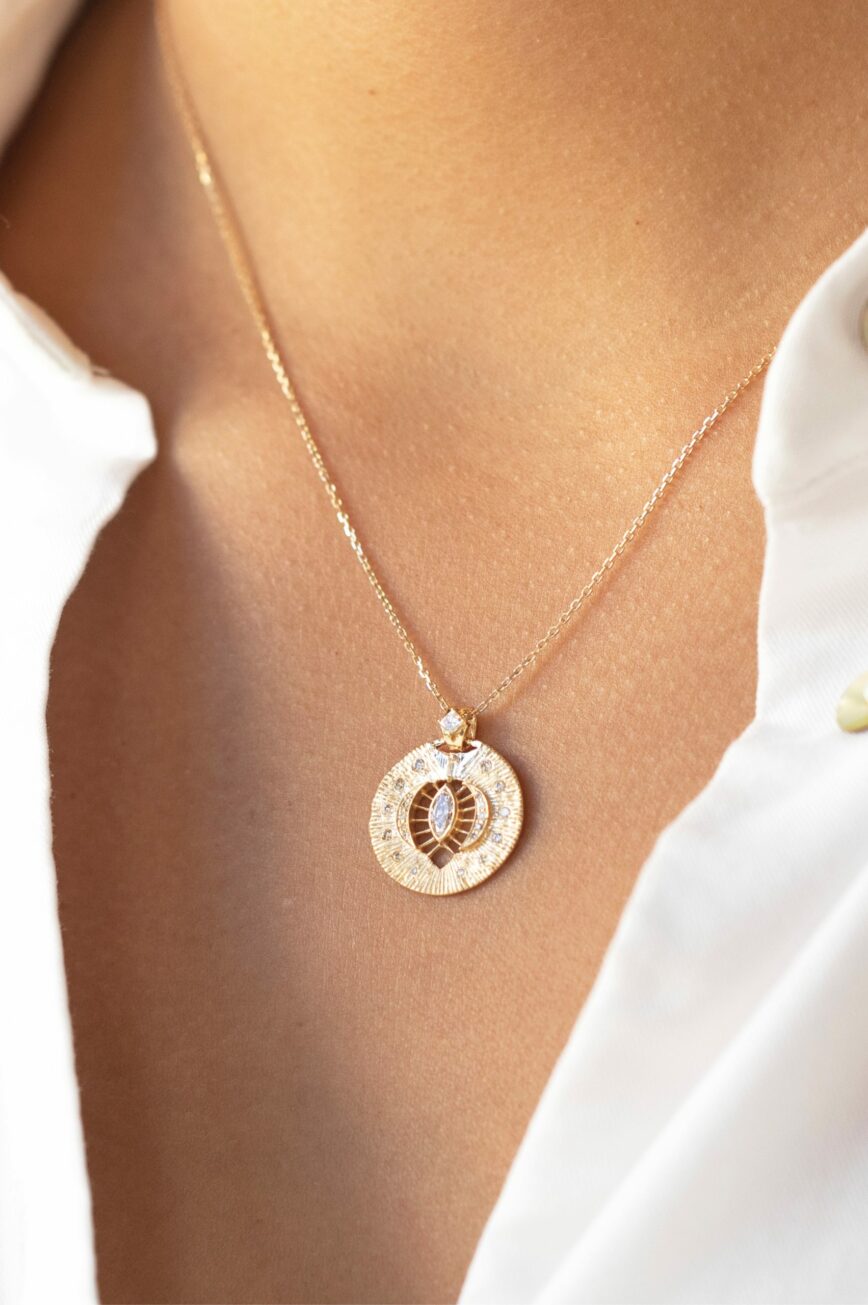 Yellow gold necklace round engraved disc pendant marquise diamond eye motif Celine Daoust