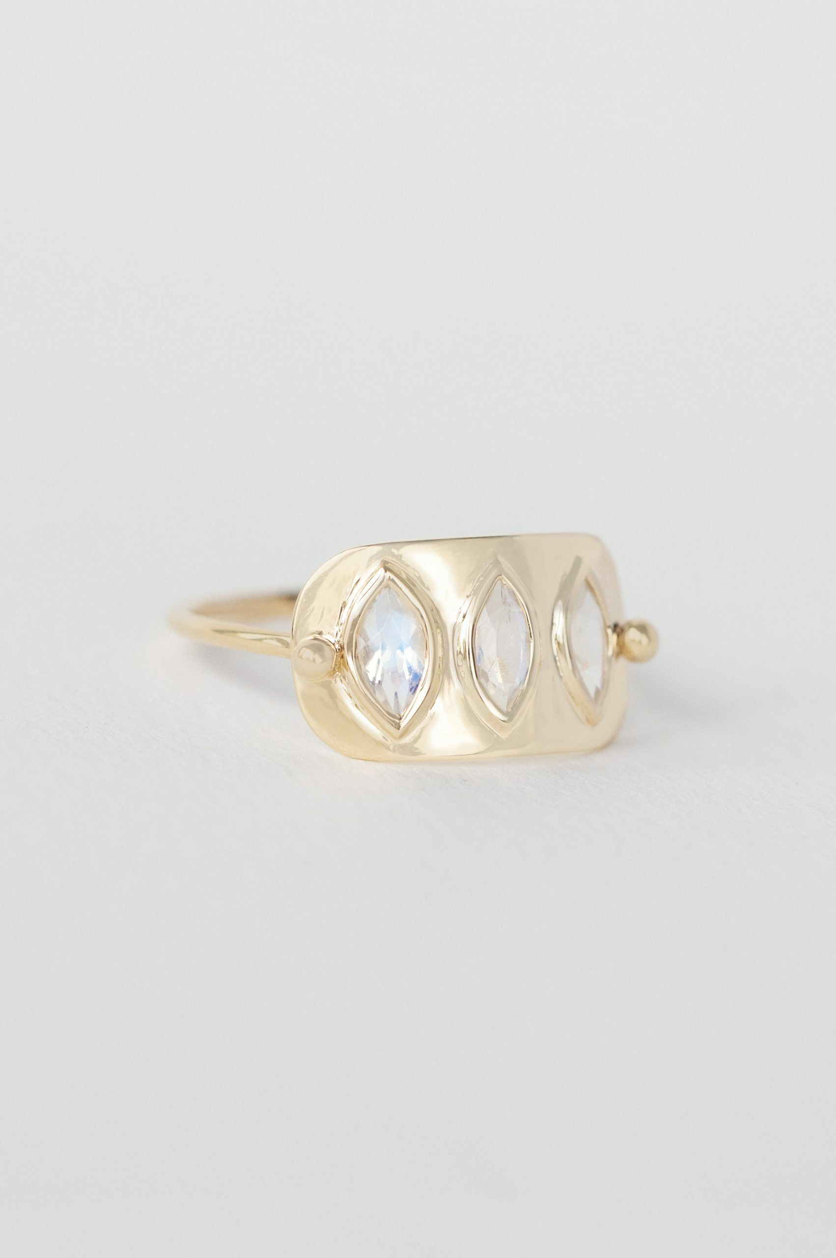 Solid gold wide band ring three marquise moonstones bezel set Céline Daoust