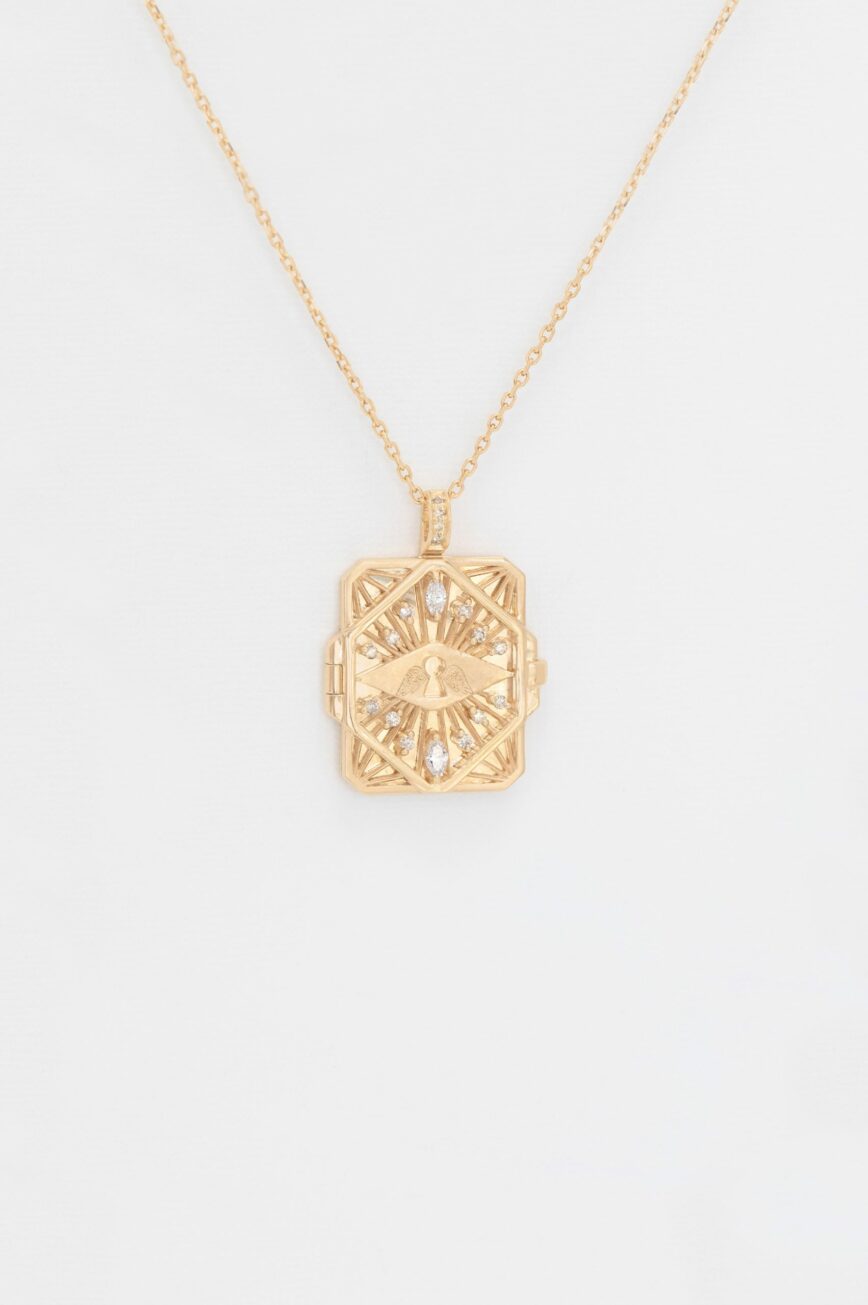 Gold necklace geometric book pendant eye motif diamond accents Celine Daoust