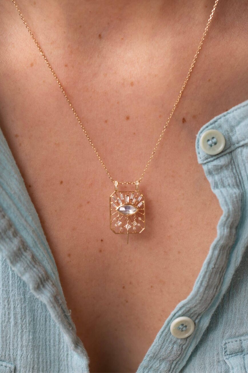 Yellow gold necklace open rectangle pendant marquise moonstone eye motif diamond accents Celine Daoust