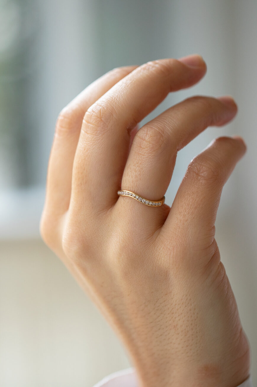Gold wave ring pavé diamond rail setting curved band Céline Daoust