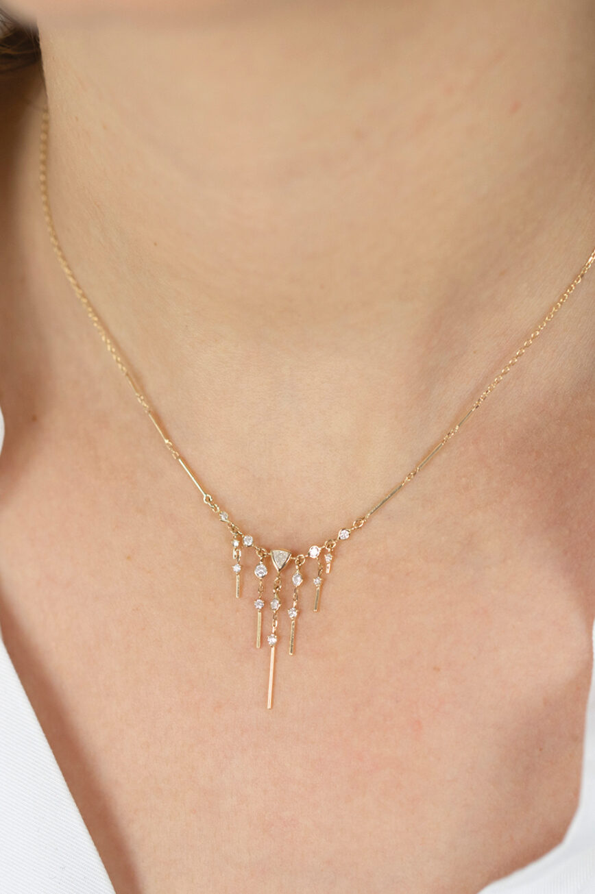 Gold necklace triangle pendant dangling diamond bar drops Celine Daoust