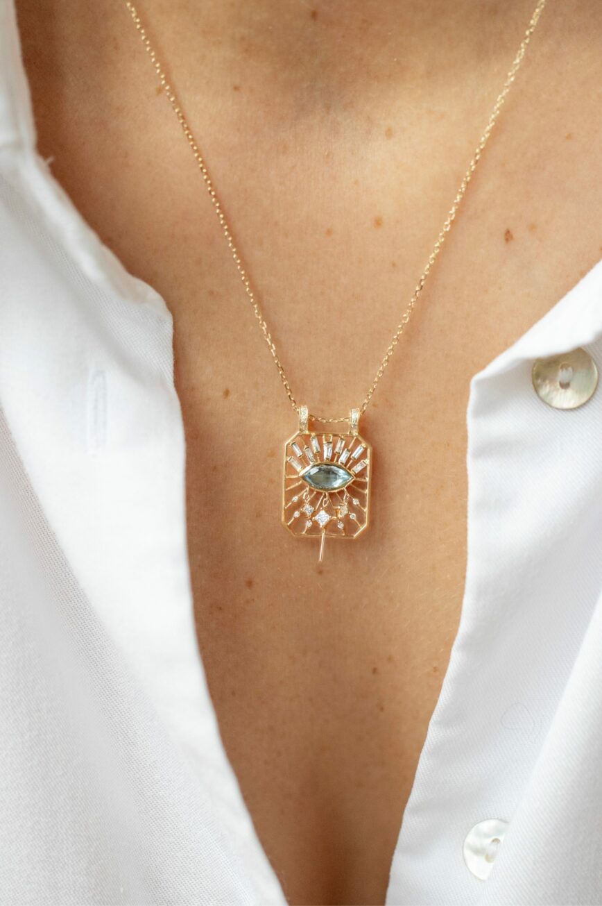 Yellow gold necklace open rectangle pendant marquise aquamarine eye motif diamond accents Celine Daoust