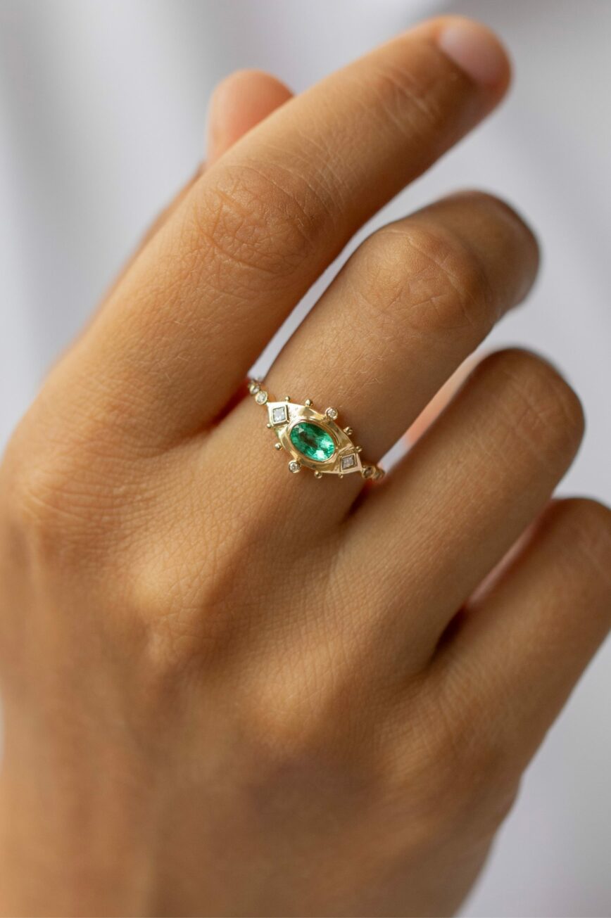Yellow gold ring marquise emerald diamond eye motif accents Celine Daoust