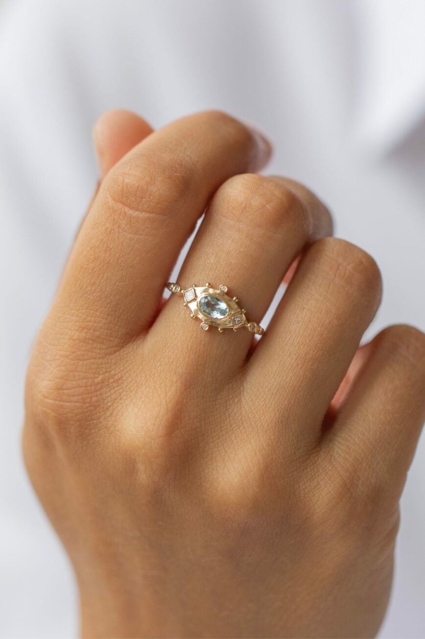 Yellow gold ring oval aquamarine diamond eye motif accents Celine Daoust
