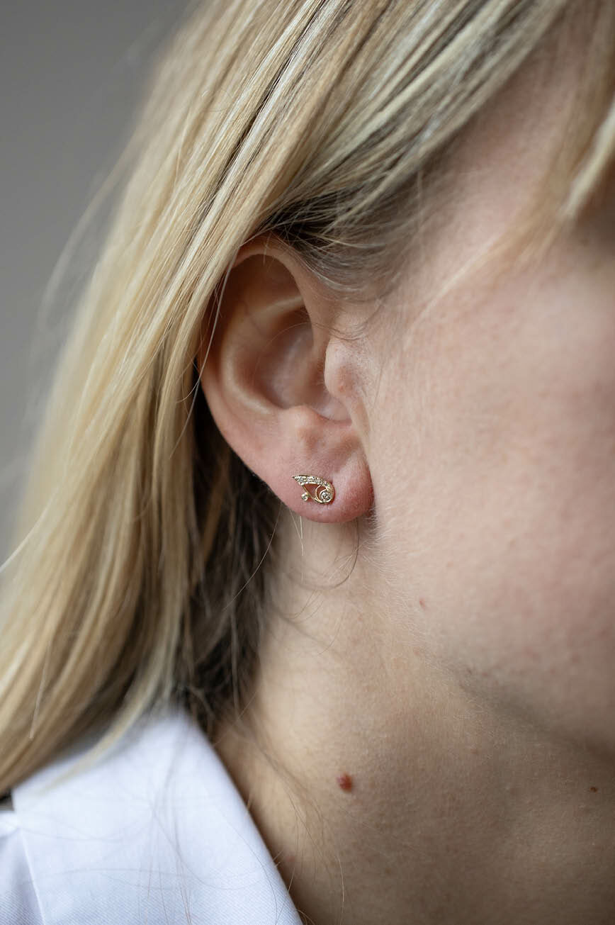 Gold stud earrings open eye motif diamond accents pair Celine Daoust