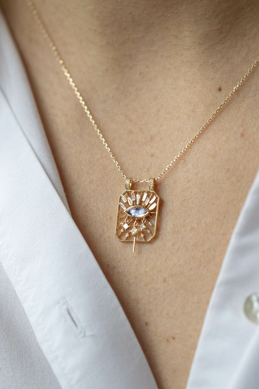 Yellow gold necklace open rectangle pendant marquise tanzanite eye diamond motif Celine Daoust