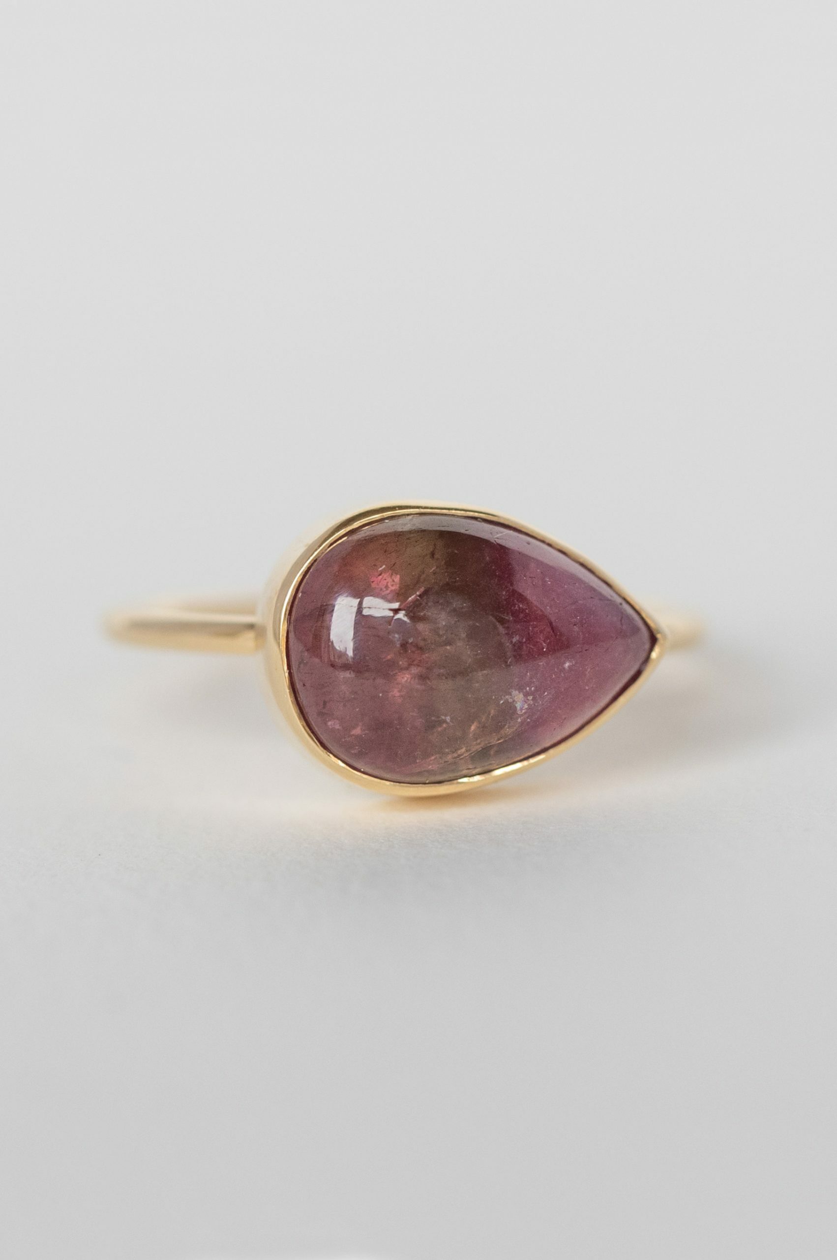 Yellow gold ring pear pink tourmaline cabochon open bezel slim band Celine Daoust