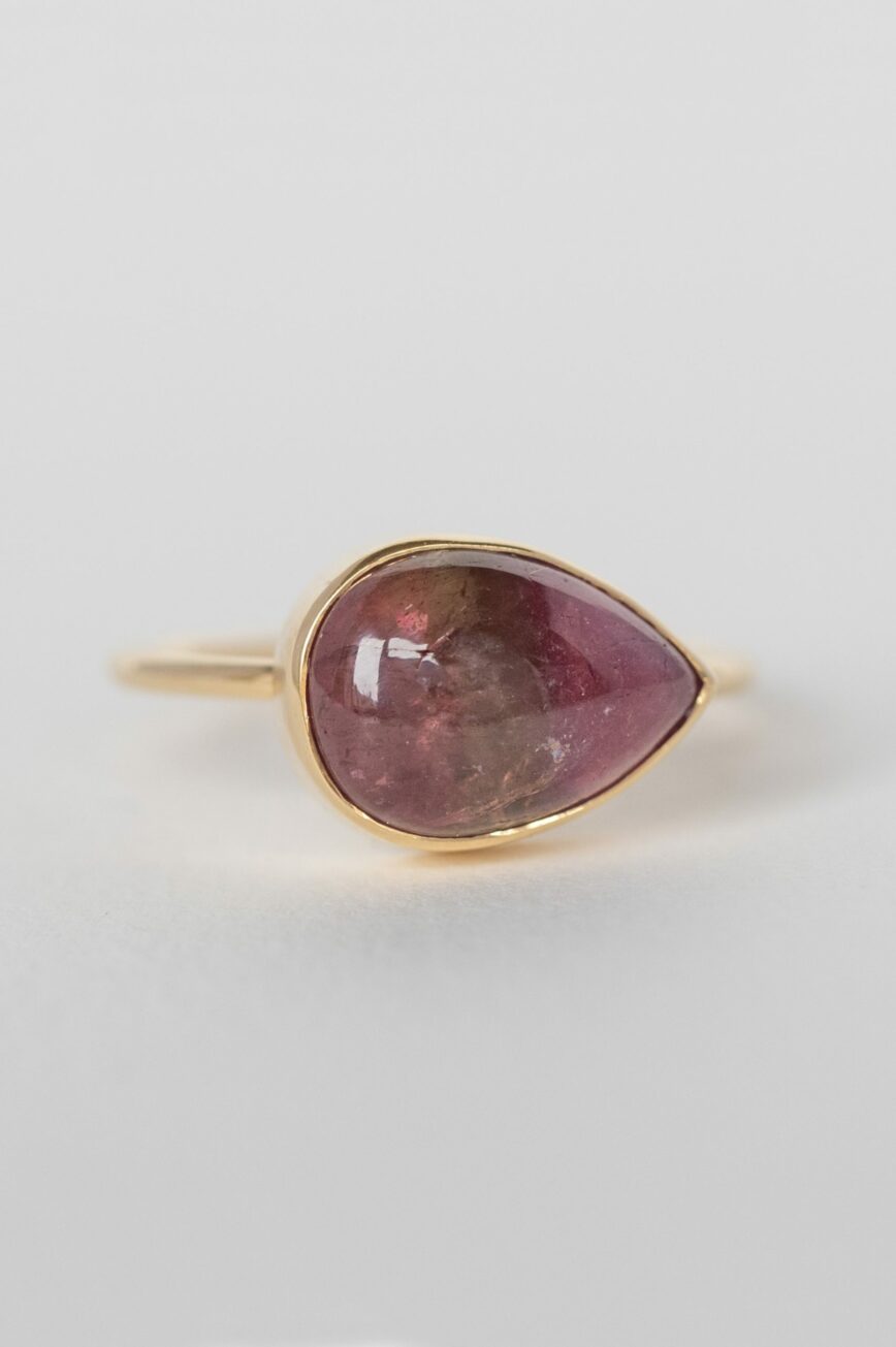 Yellow gold ring pear pink tourmaline cabochon open bezel slim band Celine Daoust
