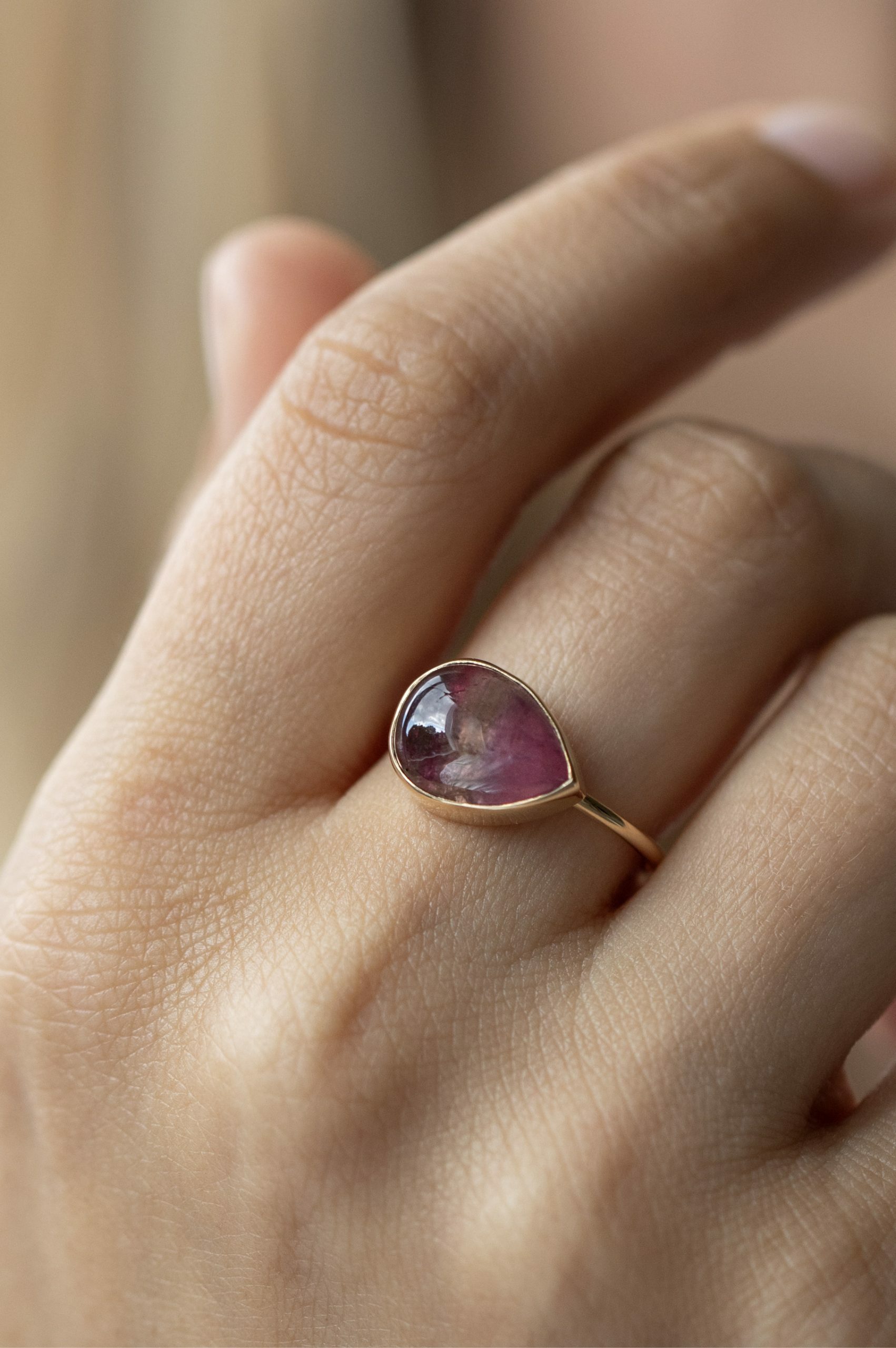 Yellow gold ring pear pink tourmaline cabochon open bezel slim band Celine Daoust