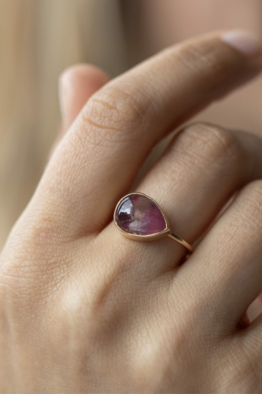 Yellow gold ring pear pink tourmaline cabochon open bezel slim band Celine Daoust