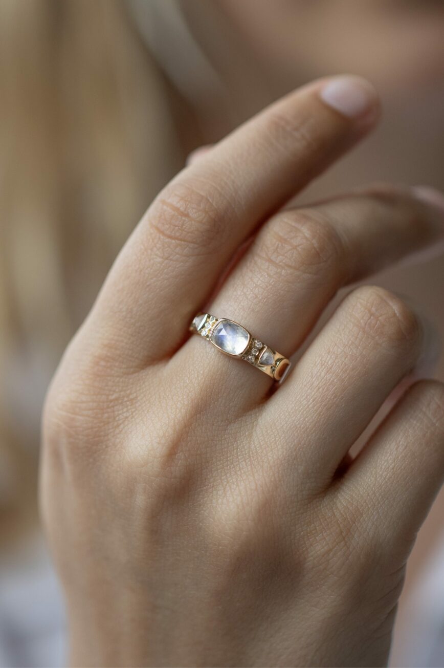 Yellow gold wide band ring oval moonstone triangle diamond totem motifs Celine Daoust