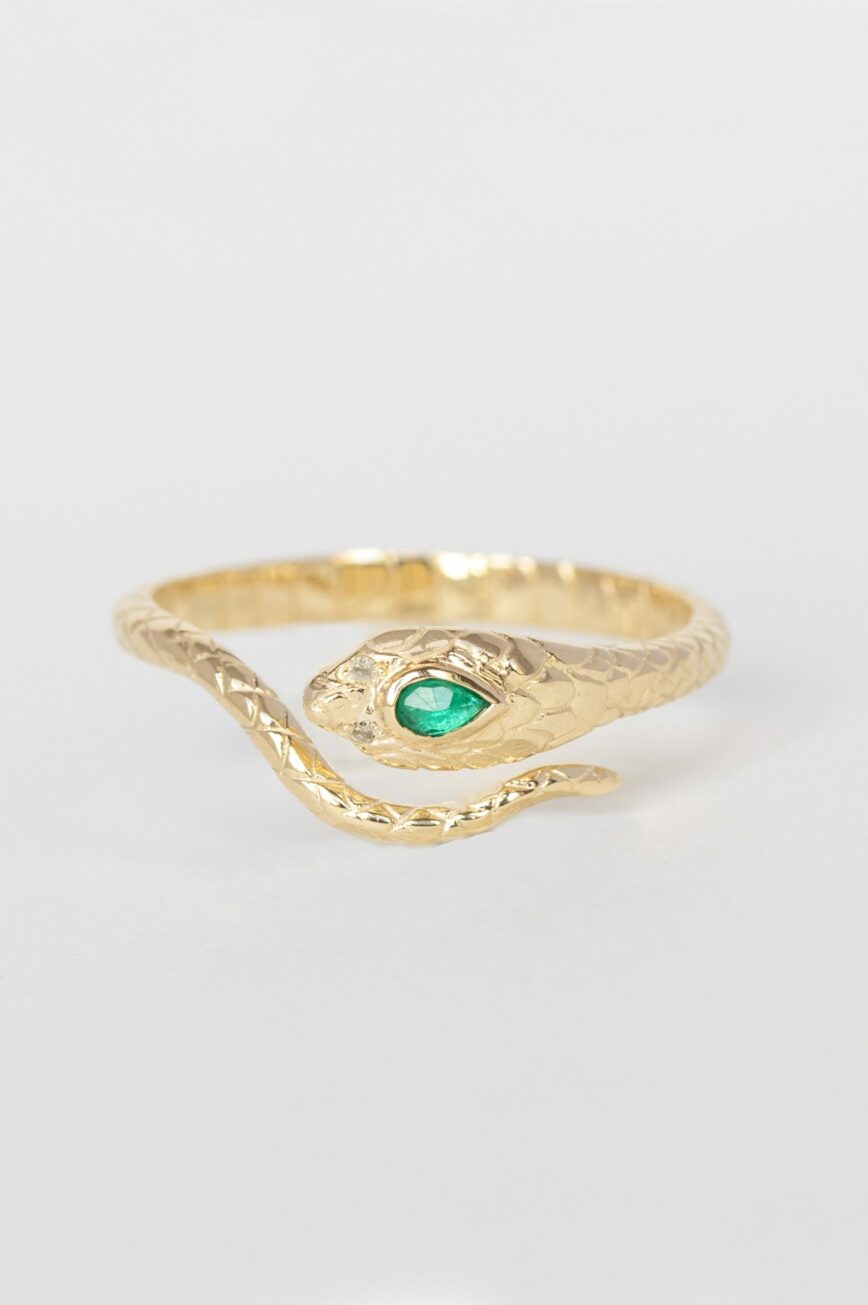 Yellow gold ring sculpted cobra motif pear emerald diamond accent Celine Daoust