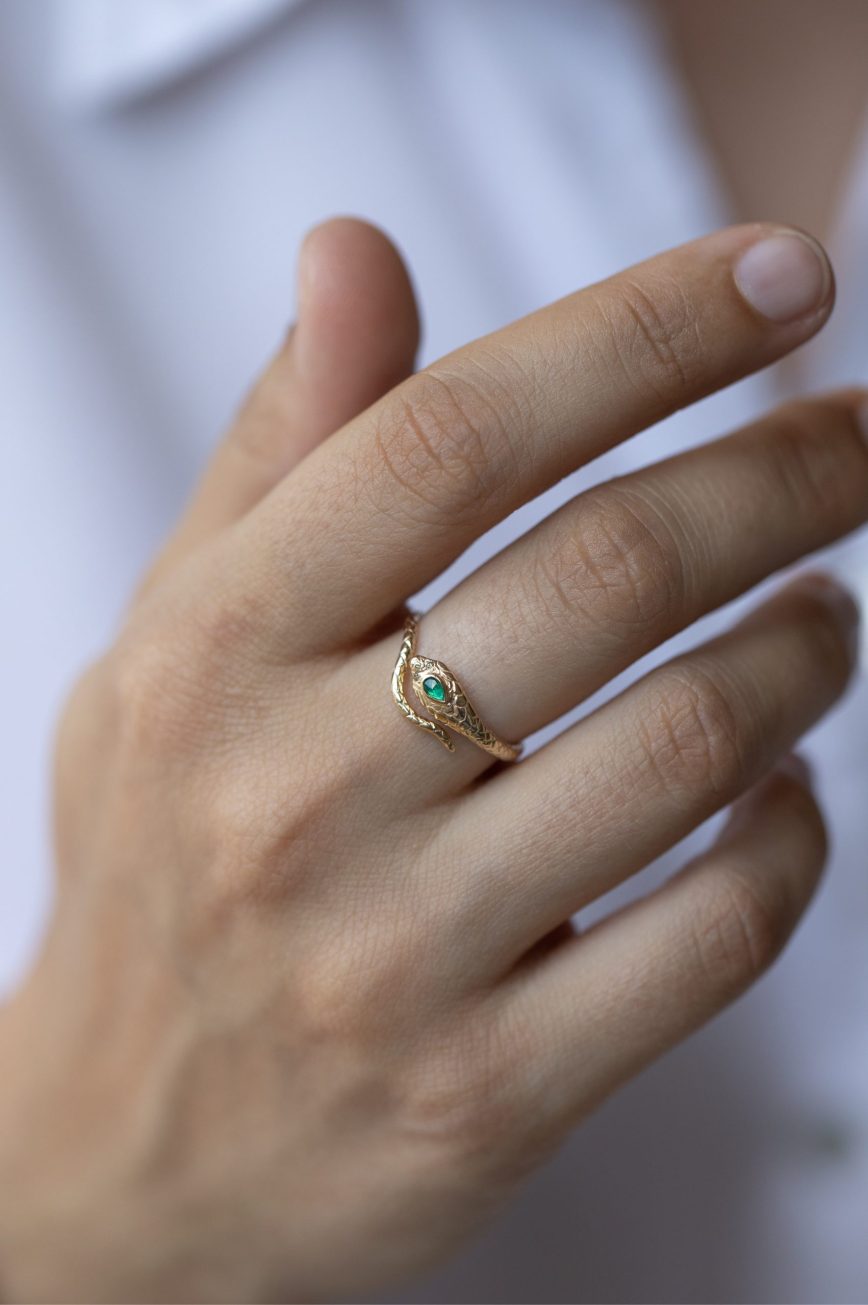 Yellow gold ring sculpted cobra motif pear emerald diamond accent Celine Daoust