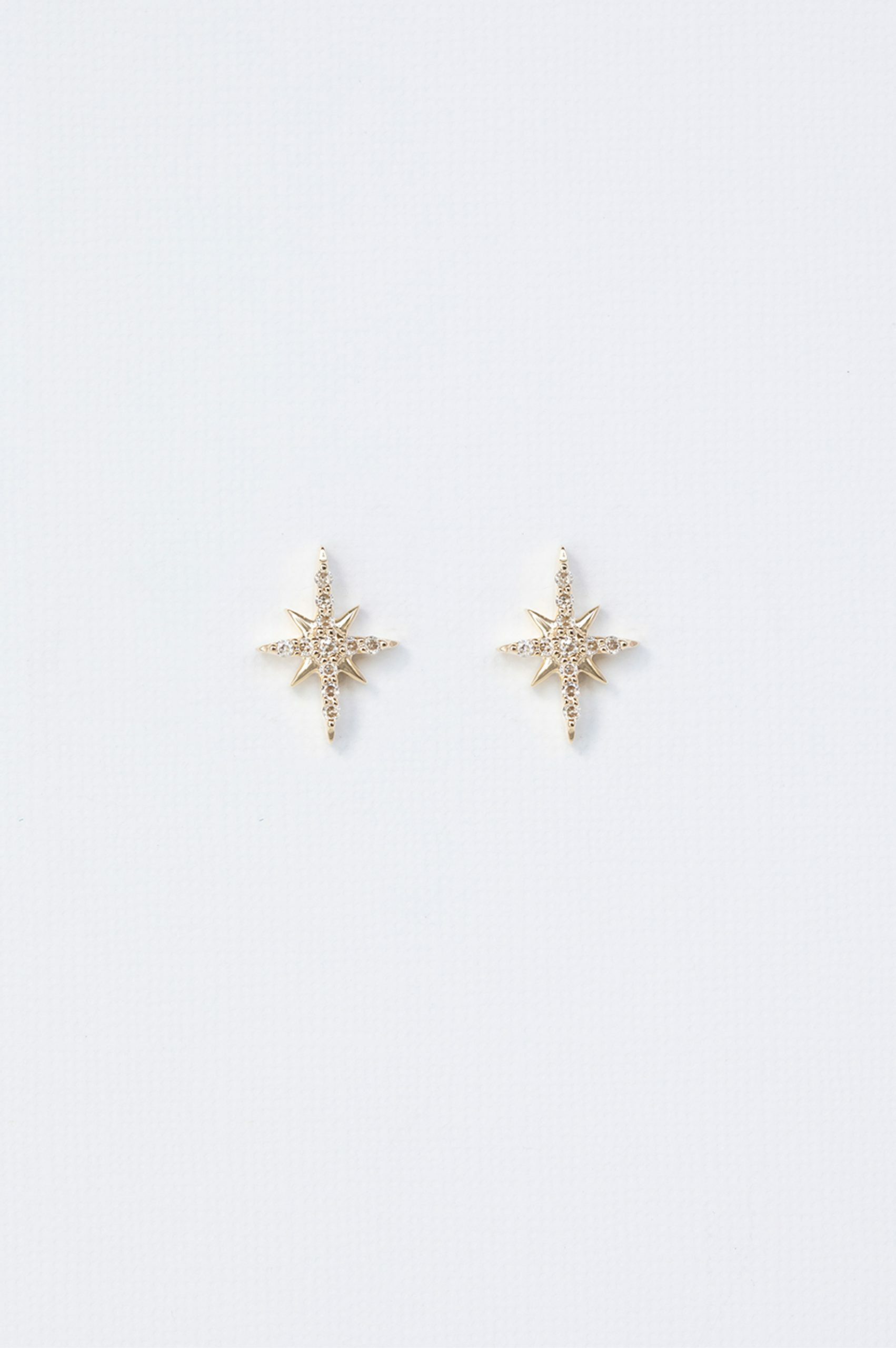 Yellow gold stud earrings eight-pointed north star diamond pavé Céline Daoust