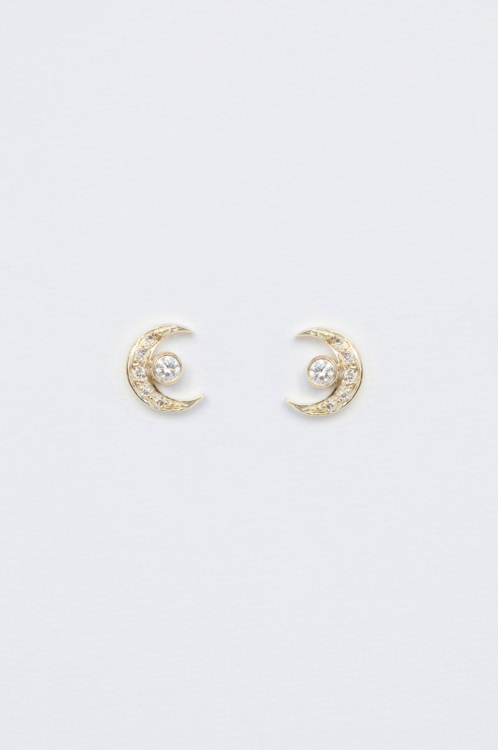 Yellow gold stud earrings crescent moon motif diamond accents pair Celine Daoust